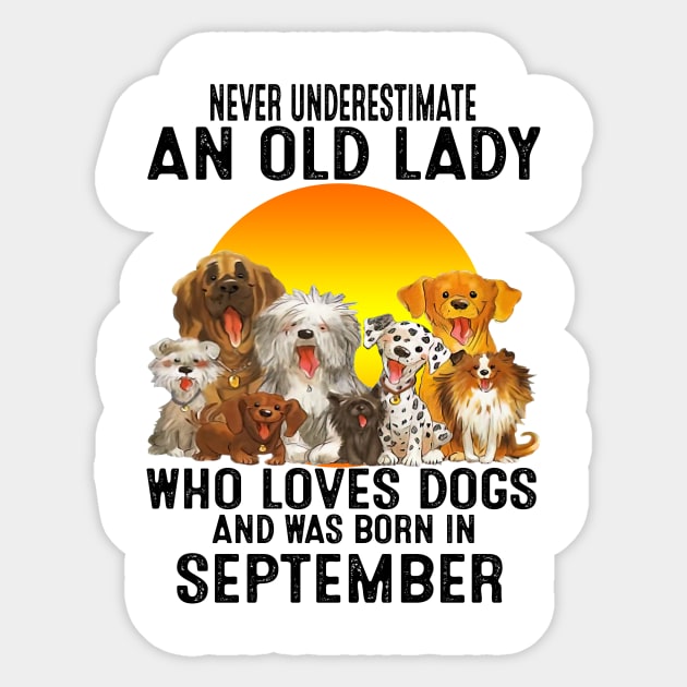 Never Underestimate An Old September Lady Who Loves Dogs Sticker by trainerunderline